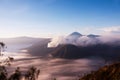 Mount Bromo surrounded by mist, an active volcano in East Java, Indonesia. Royalty Free Stock Photo