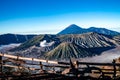 Mount Bromo volcano Batok and Semeru mountain during sunrise from viewpoint with wood fence, Tengger Semeru National Park, East