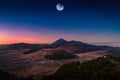 Mount Bromo volcano Gunung Bromo at sunrise with moon in Bromo Tengger Semeru National Park, East Java, Indonesia. Elements of Royalty Free Stock Photo