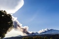 Volcano etna erupting at sunset steam clouds Royalty Free Stock Photo