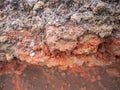 Mount Etna volcanic rocks in red iron formations. Sicily, Italy