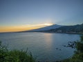 Mount Etna volcanic smoke at sunset. Sicily, Italy