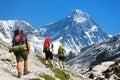 Mount Everest as seen from gokyo valley and three hikers