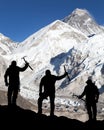 Mount Everest from Kala Patthar and silhouette of men