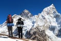 Mount Everest from Kala Patthar with two tourists