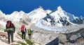 mount Everest Lhotse and Nuptse with three hikers Royalty Free Stock Photo