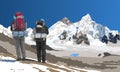 mount Everest and Nuptse from Nepal side as seen from Kala Patthar peak and two tourists with big backpacks Royalty Free Stock Photo