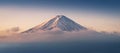 Mount Fuji enshrouded in clouds with clear sky from lake kawaguchi, Yamanashi, Japan