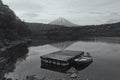 Mount fuji and floating boat on Lake Saiko with skyline reflection Royalty Free Stock Photo