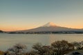 Mount Fuji with snow capped, twilight sky and beautiful Cherry Blossom or pink Sakura flower tree in Spring Season at Lake Royalty Free Stock Photo