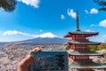 Mount Fuji viewed from behind Chureito Pagoda in full bloom cherry blossoms Royalty Free Stock Photo