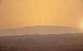 Mount Holy Cross, a monastery and a radio and television transmitter tower at the top, a colorful sunset on a March afternoon. Royalty Free Stock Photo