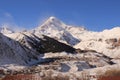 The Mount Kazbek and Gergeti village - the view from Stephantsminda, Georgia Royalty Free Stock Photo