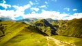 Mount Kazbek landscape. Beautiful panorama honey on green wavy natural mountain hills of Georgia on a sunny summer day