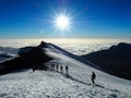 Hikers on the ridge ascend mount kilimanjaro the tallest peak in africa Royalty Free Stock Photo