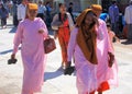 Female Buddhist monks walking in pink frocks