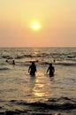 Mount Lavinia Beach. Colombo, Sri Lanka. 05th March 2016. Silhouette of Men at the beach with the sunset background