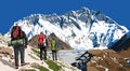 Mount Lhotse south rock face and three hikers