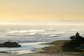 Mount maunganui main beach shrouded in sea haze caused by large surf from Cyclone Cody