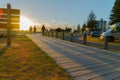 Early start to day walkers out on Mount boardwalk cast long shadows as sun rises