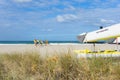 Members Mount Maunganui Surf Lifesavers club head down beach Royalty Free Stock Photo