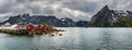 Mount Olstind above red fishing cabins in Hamnoy, Norway Royalty Free Stock Photo