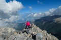 Mount Olympus - Rear view of woman with climbing helmet on cloud covered mountain summit of Mytikas Mount Olympus Royalty Free Stock Photo