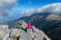 Mount Olympus - Rear view of woman with climbing helmet on cloud covered mountain summit of Mytikas Mount Olympus Royalty Free Stock Photo