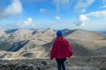 Mount Olympus - Rear view of woman with climbing helmet on cloud covered mountain summit of Skolio Mount Olympus