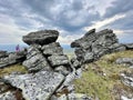 Mount Otorten, Northern Ural, Russia, July, 09, 2021.Tourist climbs the top of Mount Otorten 1234 meters. Russia, Northern Ural