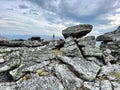 Mount Otorten, Northern Ural, Russia, July, 09, 2021.Tourist climbs the top of Mount Otorten 1234 meters. Russia, Northern Ural