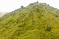 Mount Pelee green volcano hillside with hiking trail full of tourists, Martinique,  French overseas department Royalty Free Stock Photo