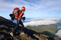 Young woman with backpack trekking on Pico volcano. Royalty Free Stock Photo