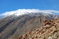 Mount Pico Viejo summit with snow and a hat of clouds. Royalty Free Stock Photo