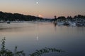 Mount Rainier and Moon Reflecting over Gig Harbor Sunset Royalty Free Stock Photo