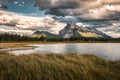 Mount Rundle with cloudy and wooden pier in Vermillion lake at Banff national park Royalty Free Stock Photo