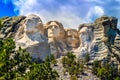 Mount Rushmore, cloudy with blue skies Royalty Free Stock Photo