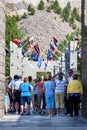 MOUNT RUSHMORE, KEYSTONE, SOUTH DAKOTA, USA - JULY 20, 2017: Group of tourists entering Mount Rushmore National Monument and takin Royalty Free Stock Photo