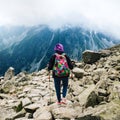 Mount Rysy Tatras Slovakia Woman traveler backpack tracking sticks top mountain Royalty Free Stock Photo