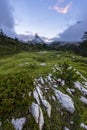 Mount Sass de Stria at sunrise, blue sky with clouds and fog, Falzarego pass, Dolomites, Veneto, Italy