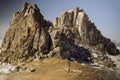 Mount Shamanka, not far from Cape Burkhan. Winter hike. Northern landscape. Sacred pillar serge