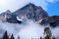 Mount Stephen`s rocky summit, emerges from cloud, Yoho National Park