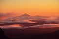 Mount Taranaki in sunset light in distance, New Zealand