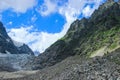 Mount Ushba in Svaneti. Georgia. Snowy top of the mountain surrounded by forest Royalty Free Stock Photo