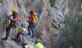 Mountain accident rescue squad prepare a hiker and set the ropes before using a stretcher