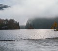 Mountain alpine autumn misty morning lake Konigssee, Schonau am Konigssee, Berchtesgaden national park, Bavaria, Germany Royalty Free Stock Photo