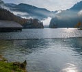 Mountain alpine autumn misty morning lake Konigssee, Schonau am Konigssee, Berchtesgaden national park, Bavaria, Germany Royalty Free Stock Photo