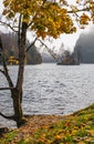 Mountain alpine autumn misty morning lake Konigssee, Schonau am Konigssee, Berchtesgaden national park, Bavaria, Germany Royalty Free Stock Photo