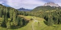 Mountain alps panorama and meadow with forest at zugspitze ehrwald