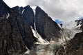Mountain Altai Russia - August 2017 large view of black rocks and glacier Small Aktru in cloudy weather with a small piece of blue